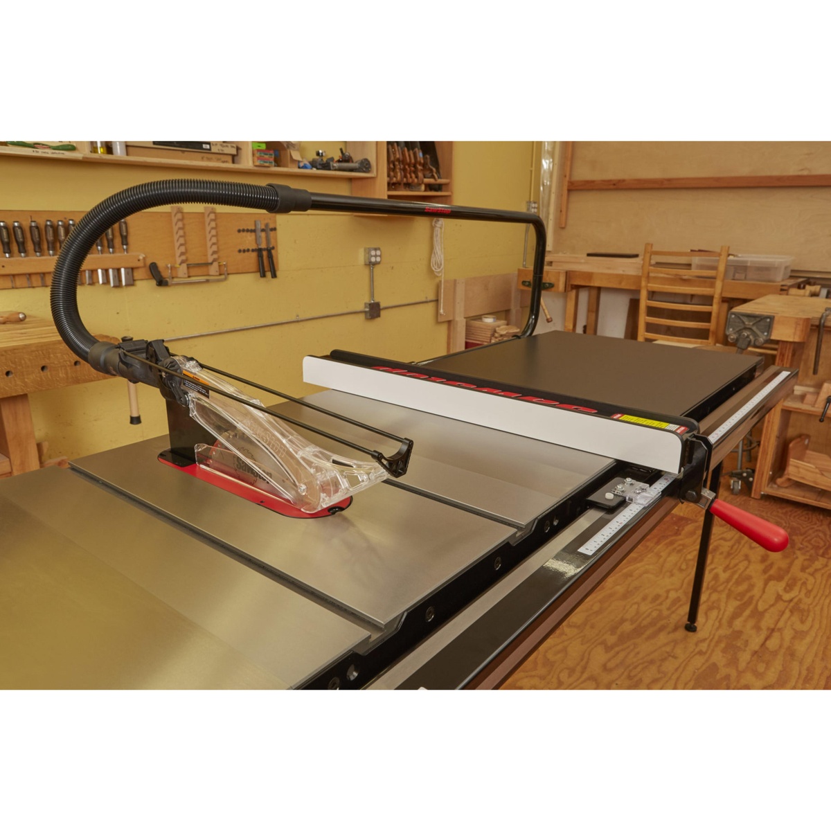 SawStop PCS31230-TGP236 Professional Cabinet Saw with 36 inch T-Glide fence and overarm dust collection shown on a shop floor for precision table saw fence setup