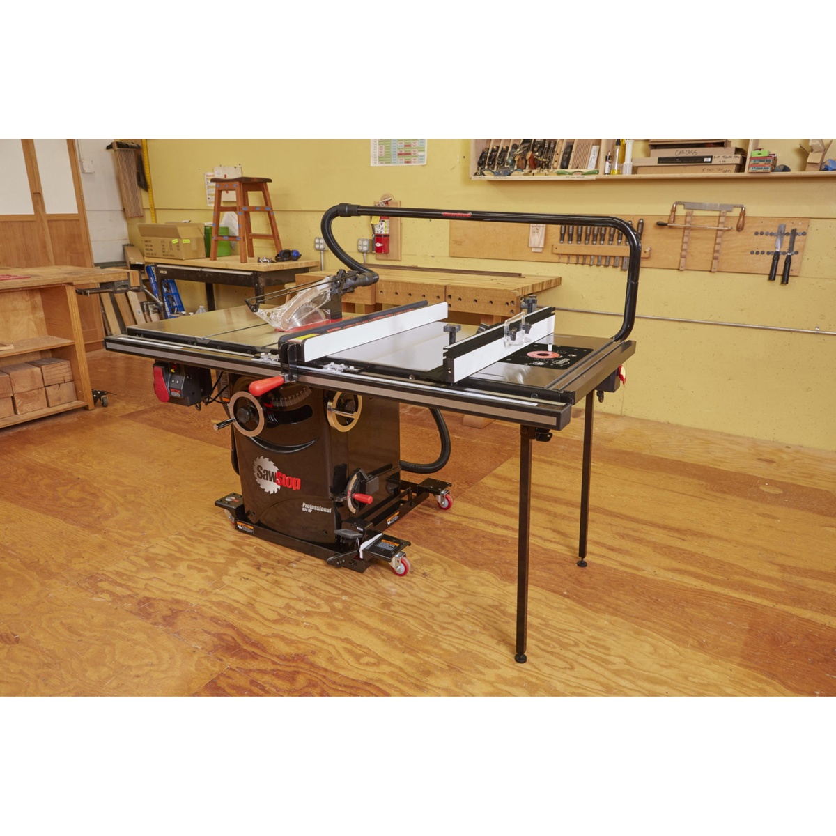SawStop RT-TGP 27 Inch In-Line Router Table mounted to a SawStop table saw in a woodworking shop, showing the integrated router table surface and fence for space-saving routing work