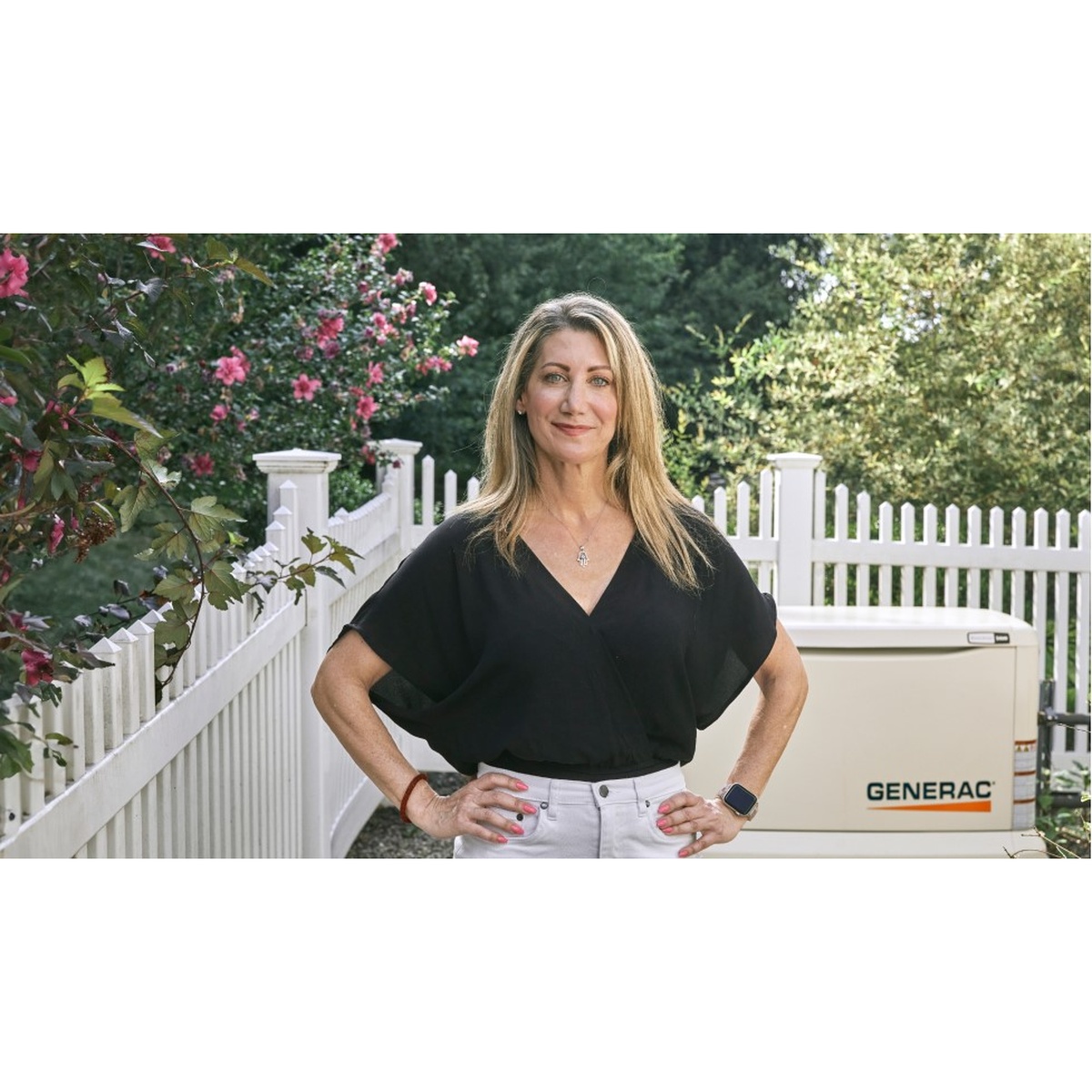 Generac 7209 Guardian 24kW Automatic Home Standby Generator Wi-Fi Enabled installed outdoors beside a residential fence for whole-home emergency backup power