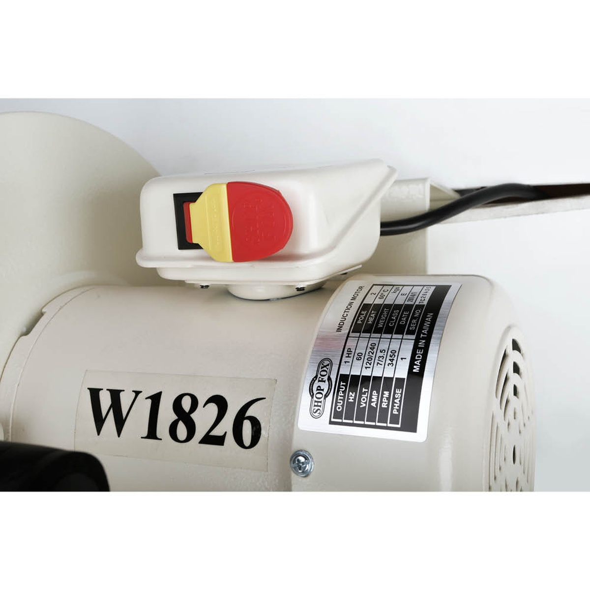 Shop Fox W1826 Wall Dust Collector motor housing and power switch close-up showing dual-voltage woodworking dust collector design