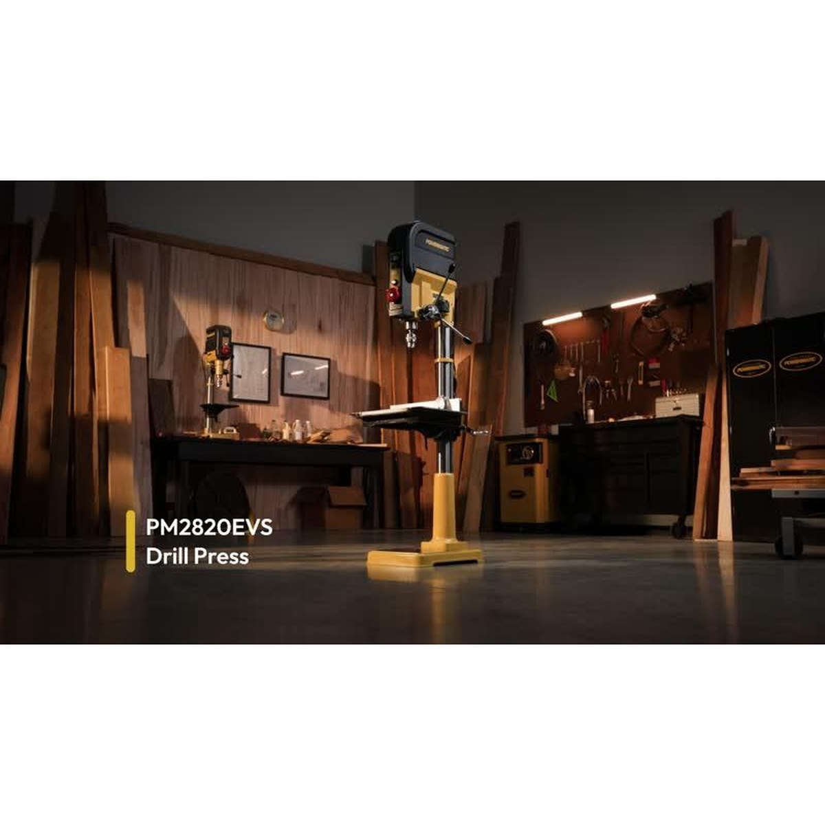 Powermatic PM2820EVS Drill Press standing in a professional woodworking shop, showing its full floor-standing design and heavy cast base