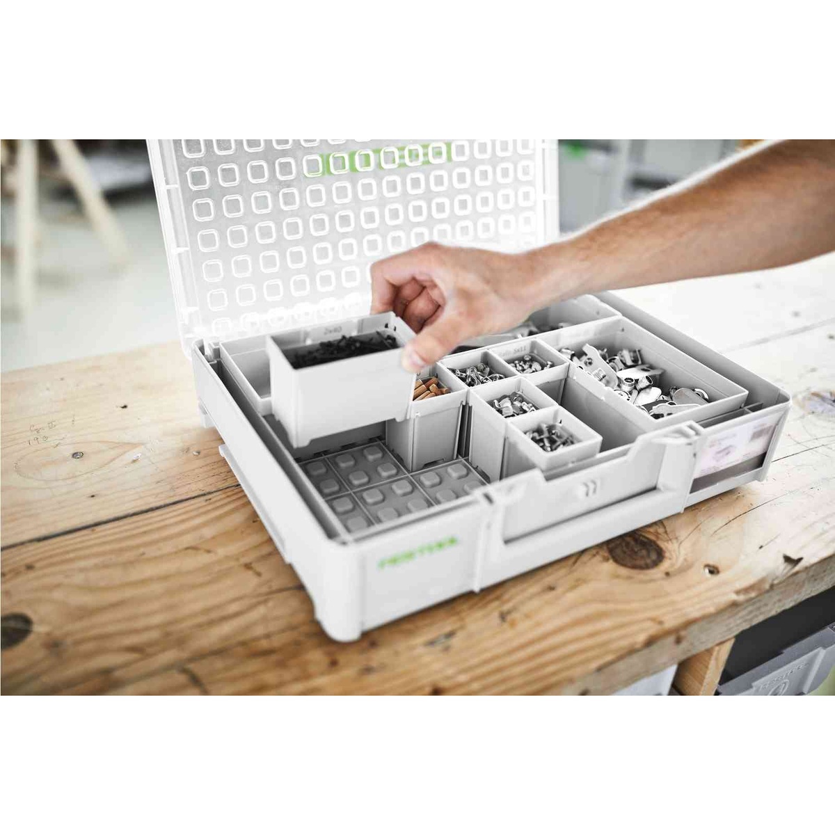 Festool 204853 Systainer3 Organizer M 89 with 22 Containers on a workbench with a removable bin lifted out to show flexible small-parts organization