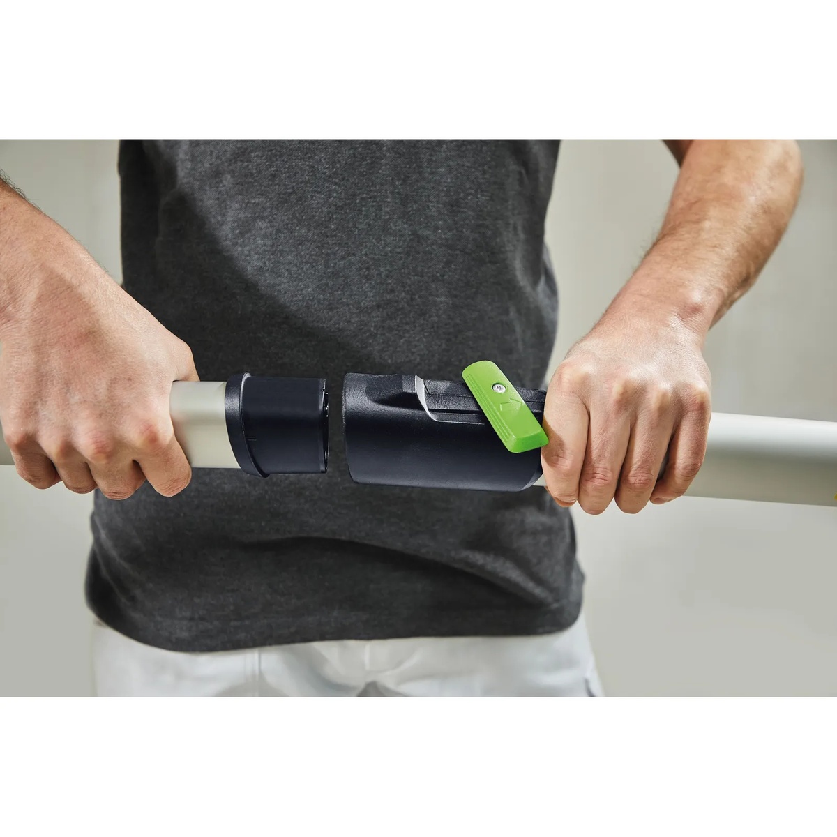 Close-up of the Festool PLANEX 2 handle extension tool-free latch connecting to the long-reach sander shaft during setup
