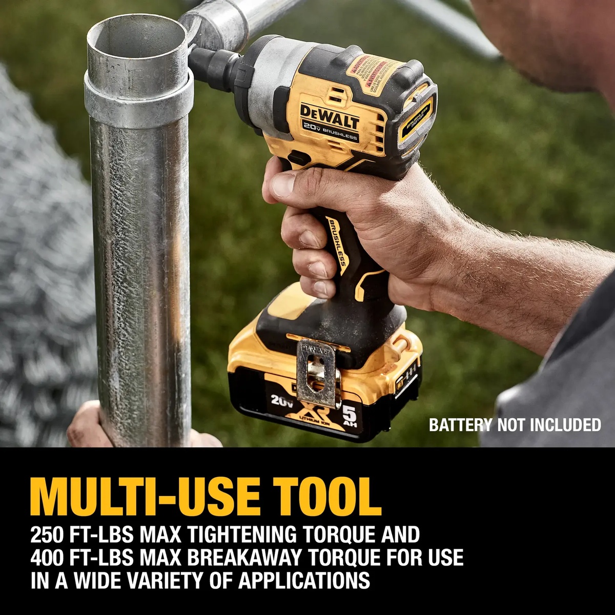 DeWALT DCF911B 20V MAX 1/2-in. impact wrench loosening or tightening a metal pipe fastener in an outdoor work setting