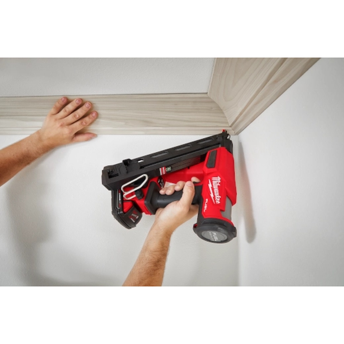 Milwaukee 2839-20 M18 FUEL 15 Gauge Finish Nailer fastening crown molding in a tight inside corner overhead