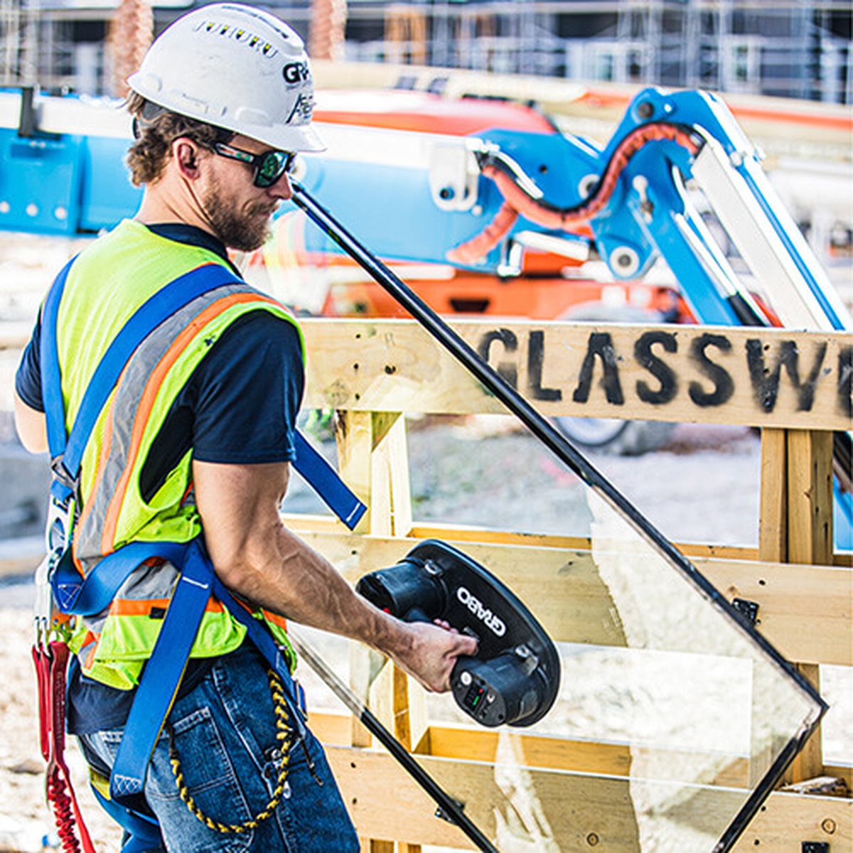 Grabo GP-1Li-FB Pro-Lifter 20 Vacuum Lift System Kit used to handle a glass panel on an active construction site