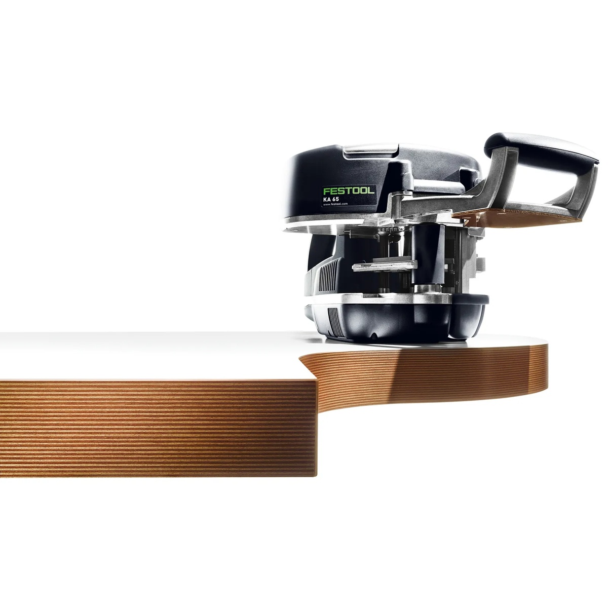 Festool Conturo KA 65 Hand Held Edge Bander applying edge banding to a curved wood panel for shaped furniture or custom cabinet work