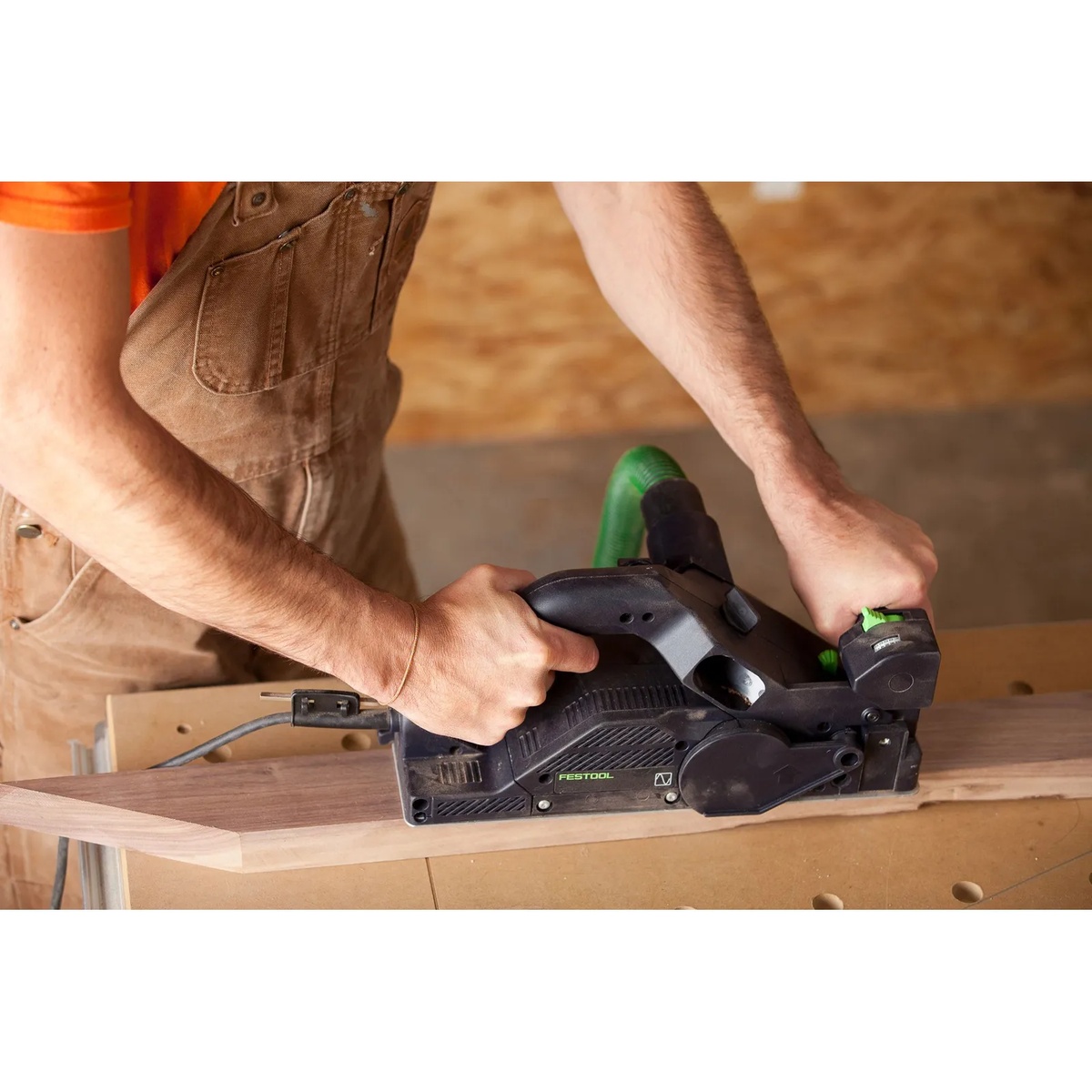 Festool HL 850 E-F-Plus Planer trimming the edge of a wood board on a bench during finish carpentry work