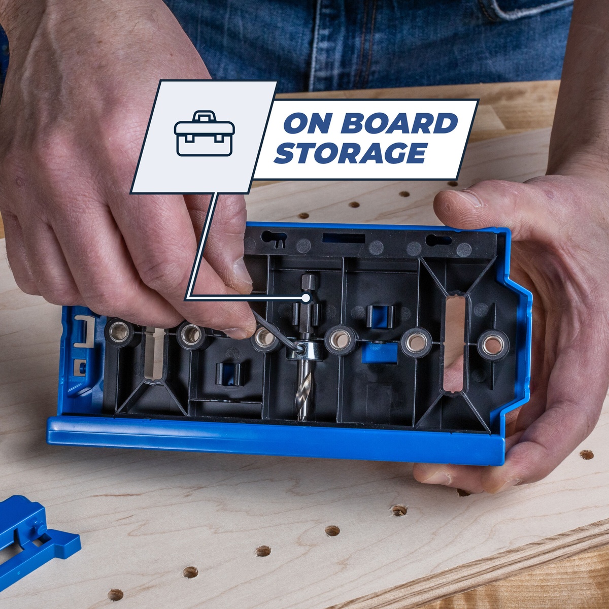 Kreg KMA3225 Shelf Pin Jig 1/4 in on-board storage holding the drill bit and accessories while working on a plywood cabinet panel