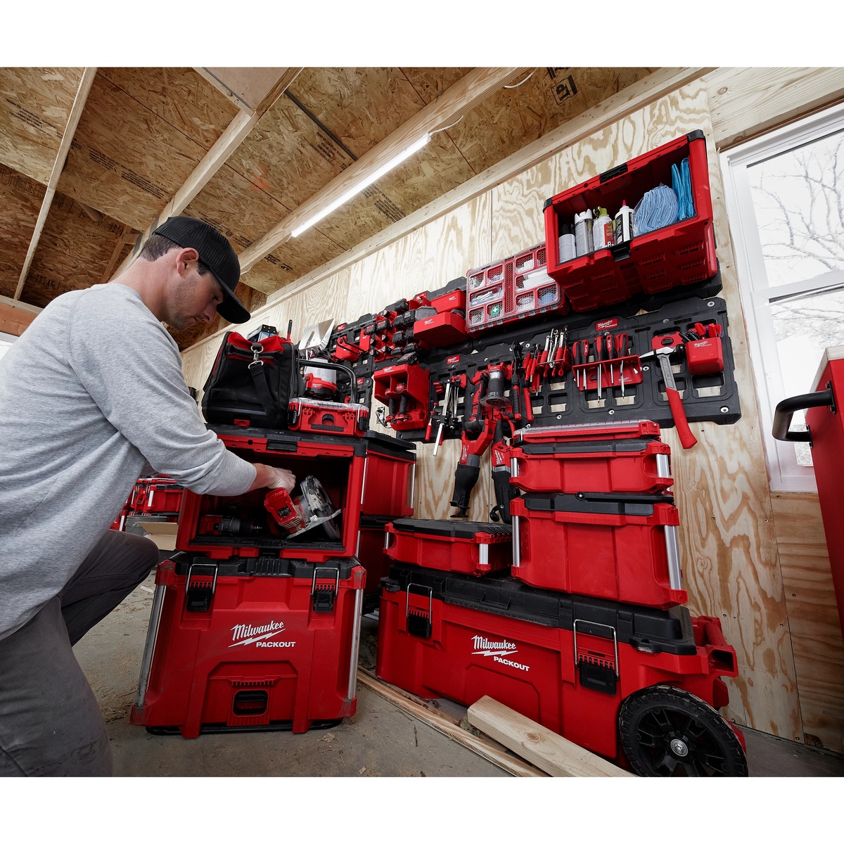 Milwaukee PACKOUT cabinet installed with other PACKOUT storage on a workshop wall for organized tool and accessory storage