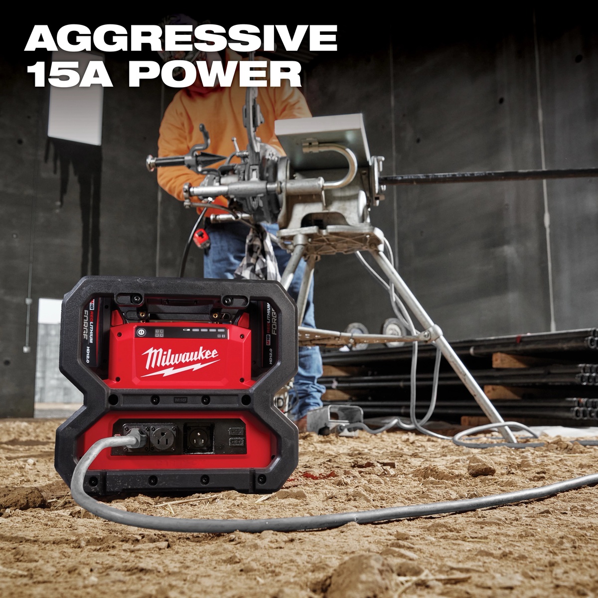 Milwaukee 2845-20 M18 CARRY-ON 3600W/1800W Power Supply operating a pipe threading machine on an indoor construction site