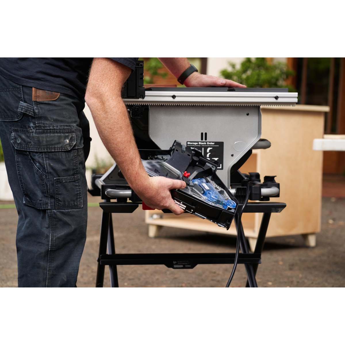 Rear storage area on the SawStop CTS-120A60 10 inch Compact Table Saw holding guards and accessories for transport between jobsites