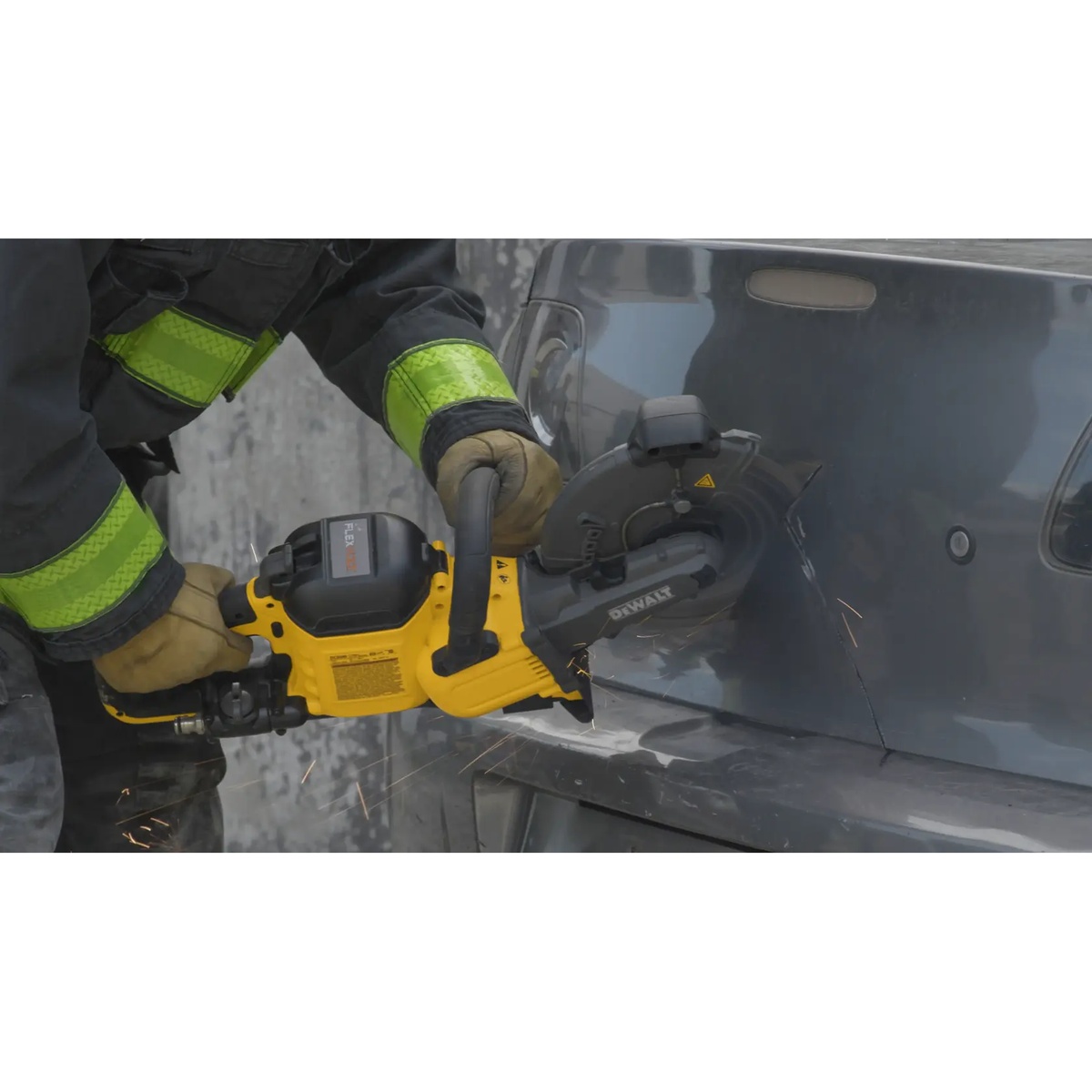 DEWALT DCS692B 60V MAX 9 in. Brushless Cordless Cut-Off Saw cutting sheet metal on a jobsite with sparks visible during metal cutting