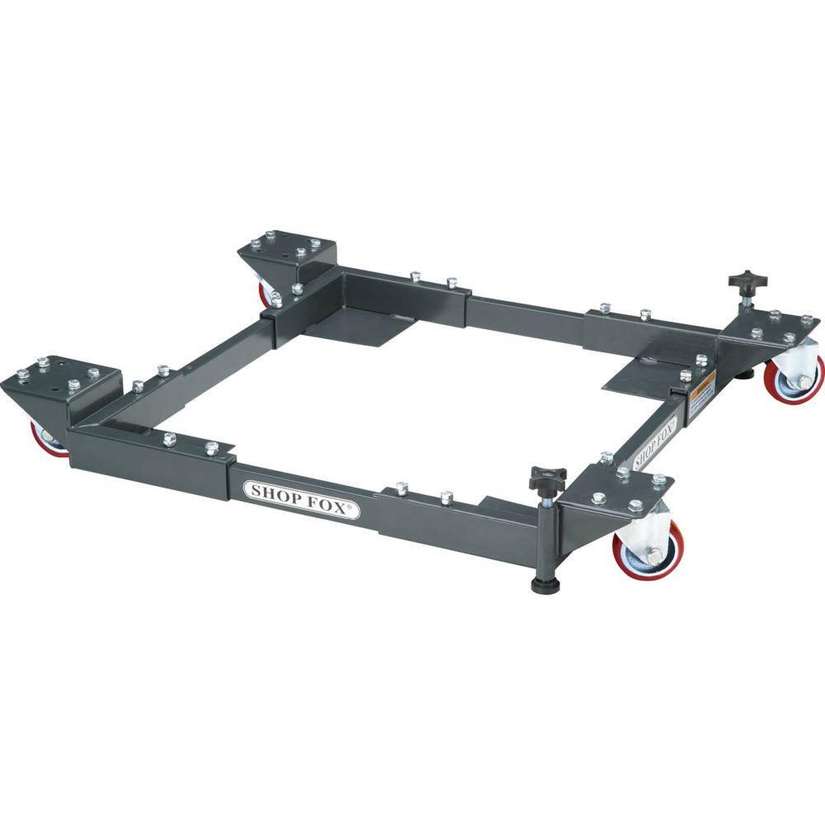 Shop Fox D2057A Adjustable Mobile Base - Heavy-Duty shown as an adjustable steel mobile base for stationary woodworking equipment in a workshop setup