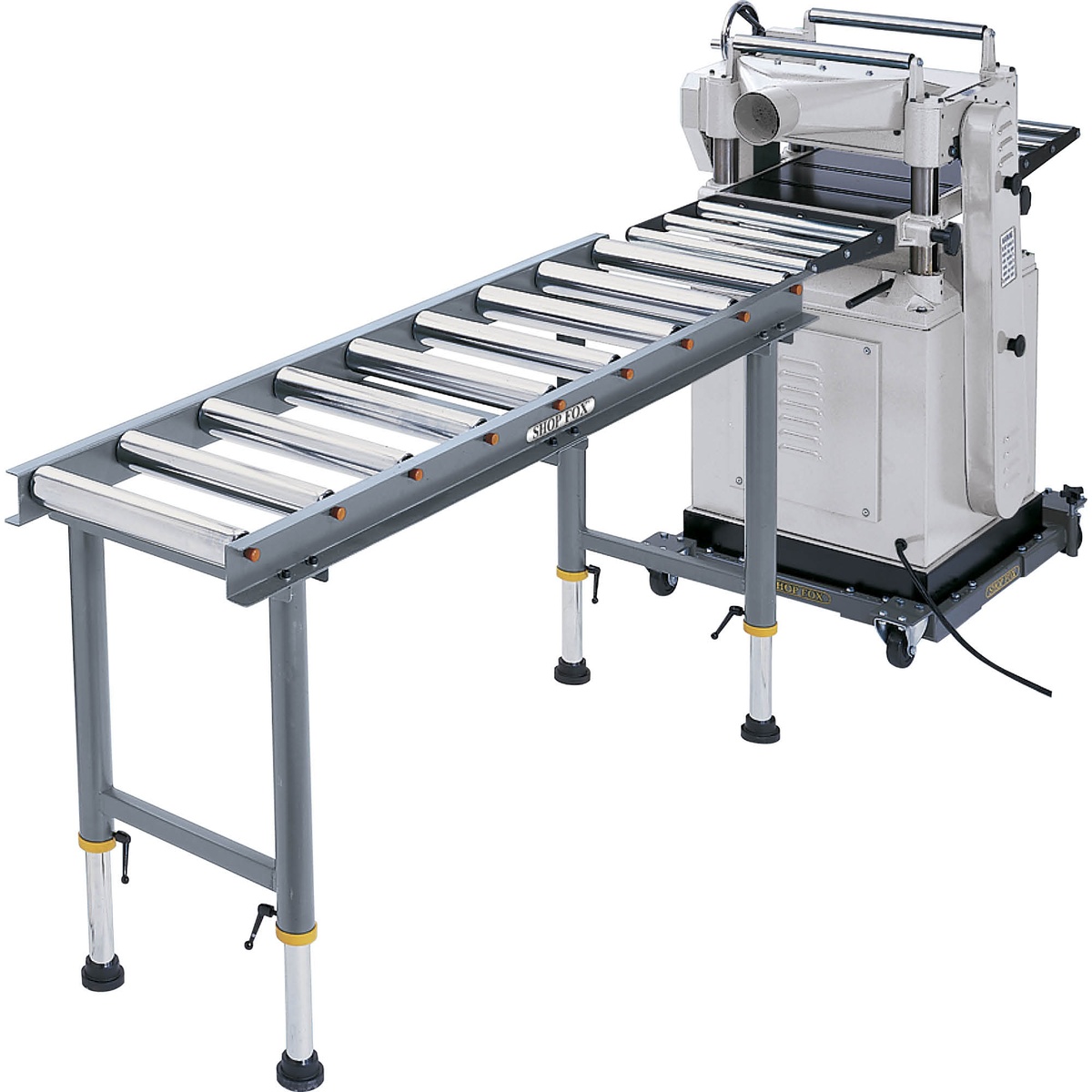 Shop Fox D2271 Heavy-Duty 9 Roller Table supporting long material beside a planer in a woodworking shop setup