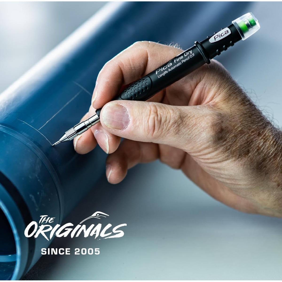 Pica Fine Dry 7070 Longlife Automatic Pencil, 0.9 marking on a plastic pipe during plumbing or mechanical layout work
