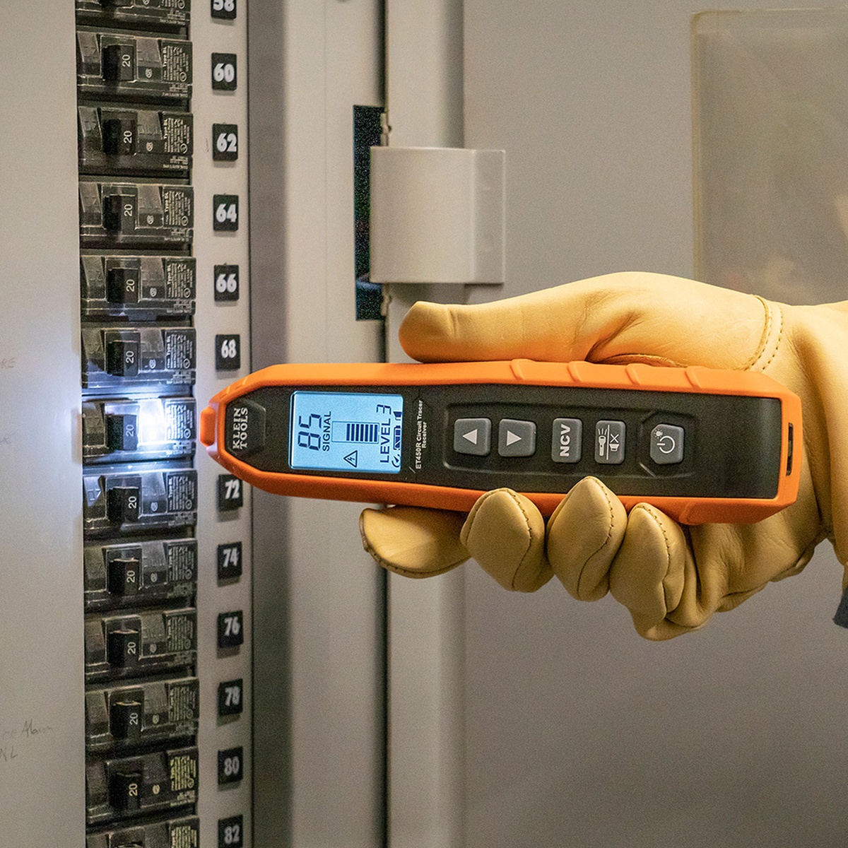 Klein Tools ET450 Advanced Electrical Circuit Breaker Finder and Wire Tracer Kit and Case receiver identifying a breaker inside an electrical panel during troubleshooting