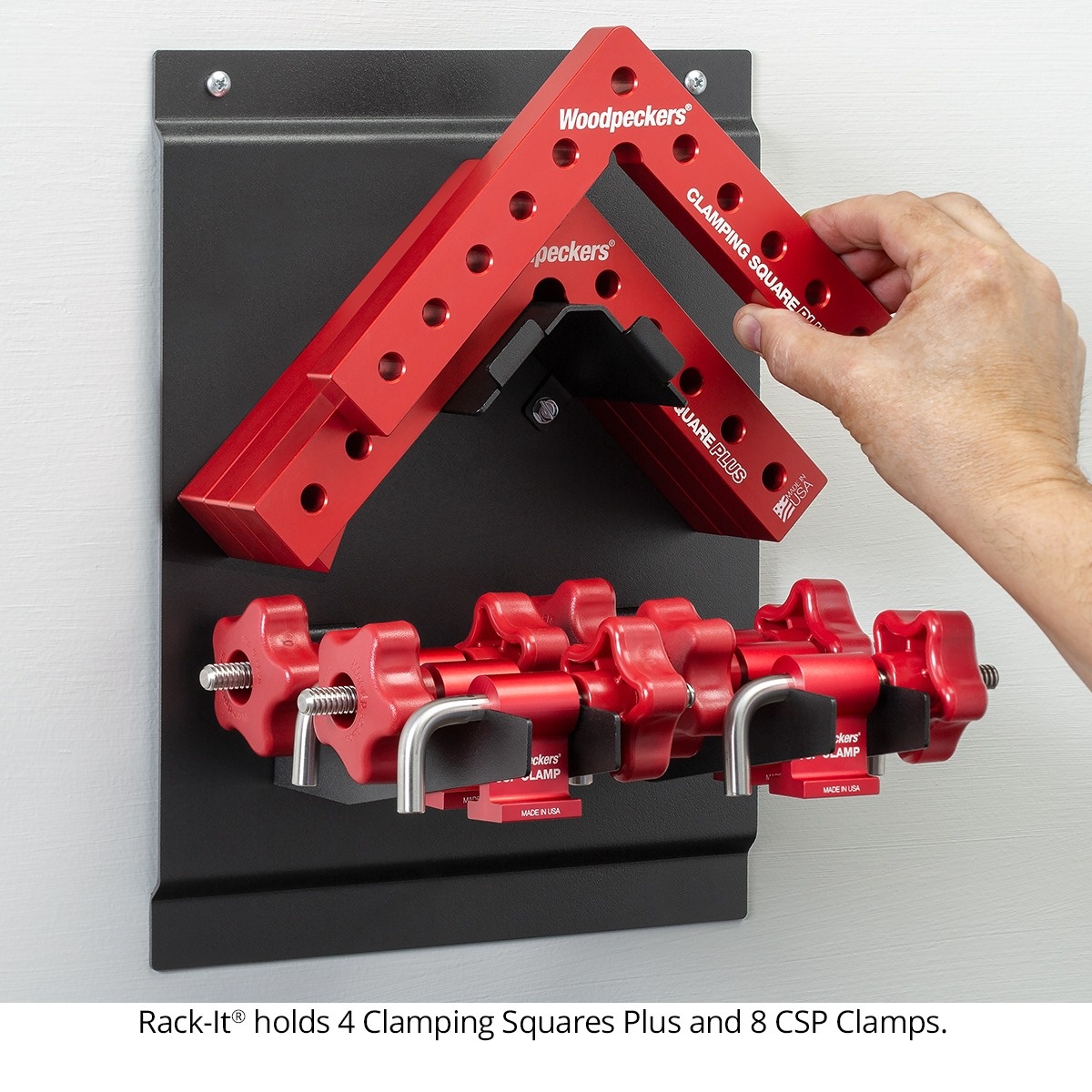 Woodpeckers CSP clamps stored on a wall rack with Clamping Squares Plus for organized access in the shop