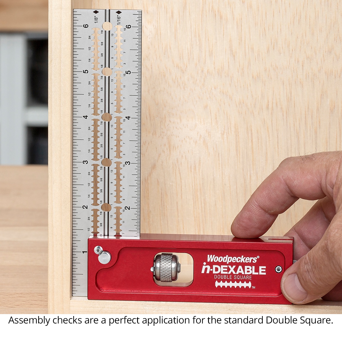 Woodpeckers in-DEXABLE Double Square Standard checking a cabinet assembly corner on a woodworking bench for square alignment