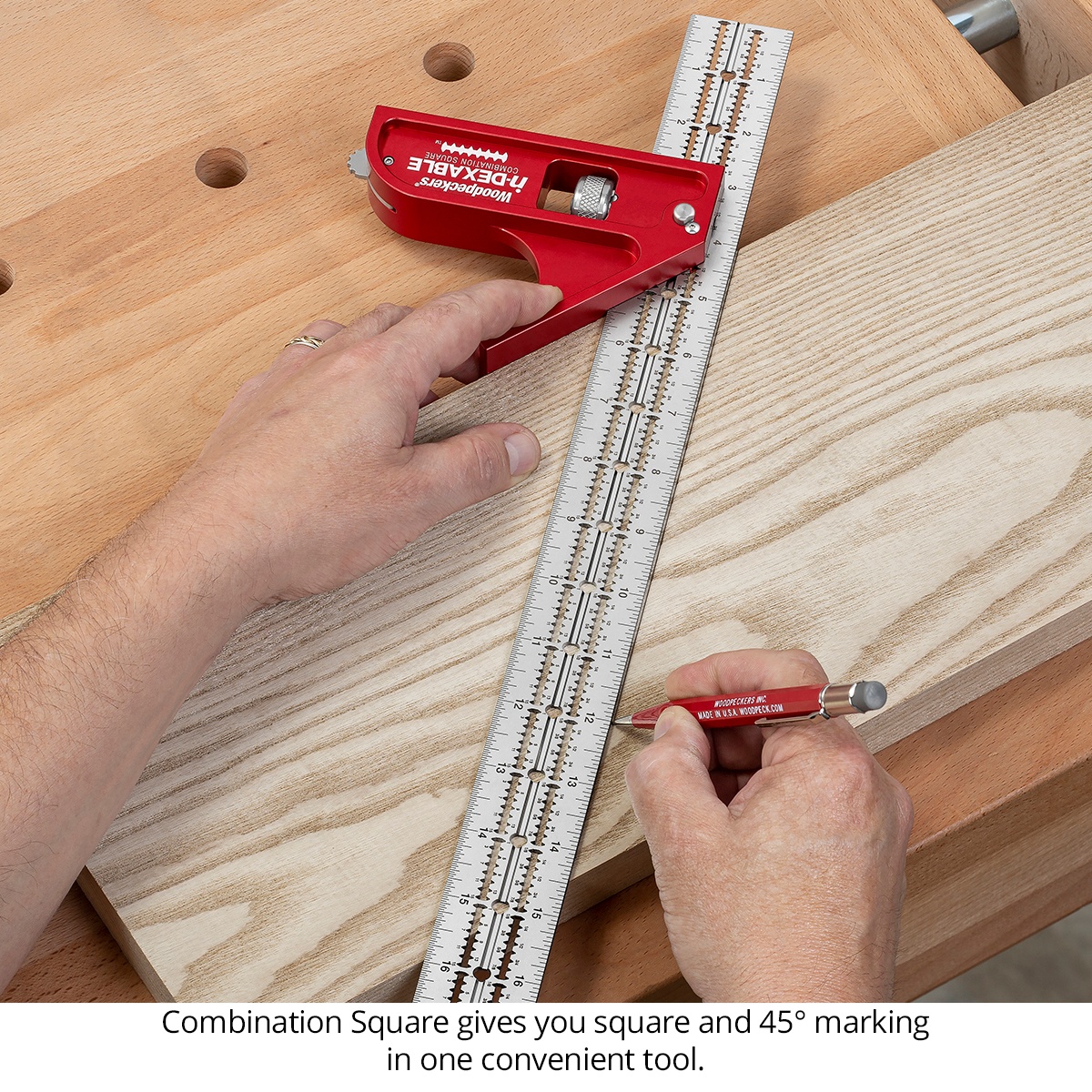 Woodpeckers CSQ-XL-20 in-DEXABLE Combo Square XL - 18 in. Blade marking a ninety degree line across a board on a workbench