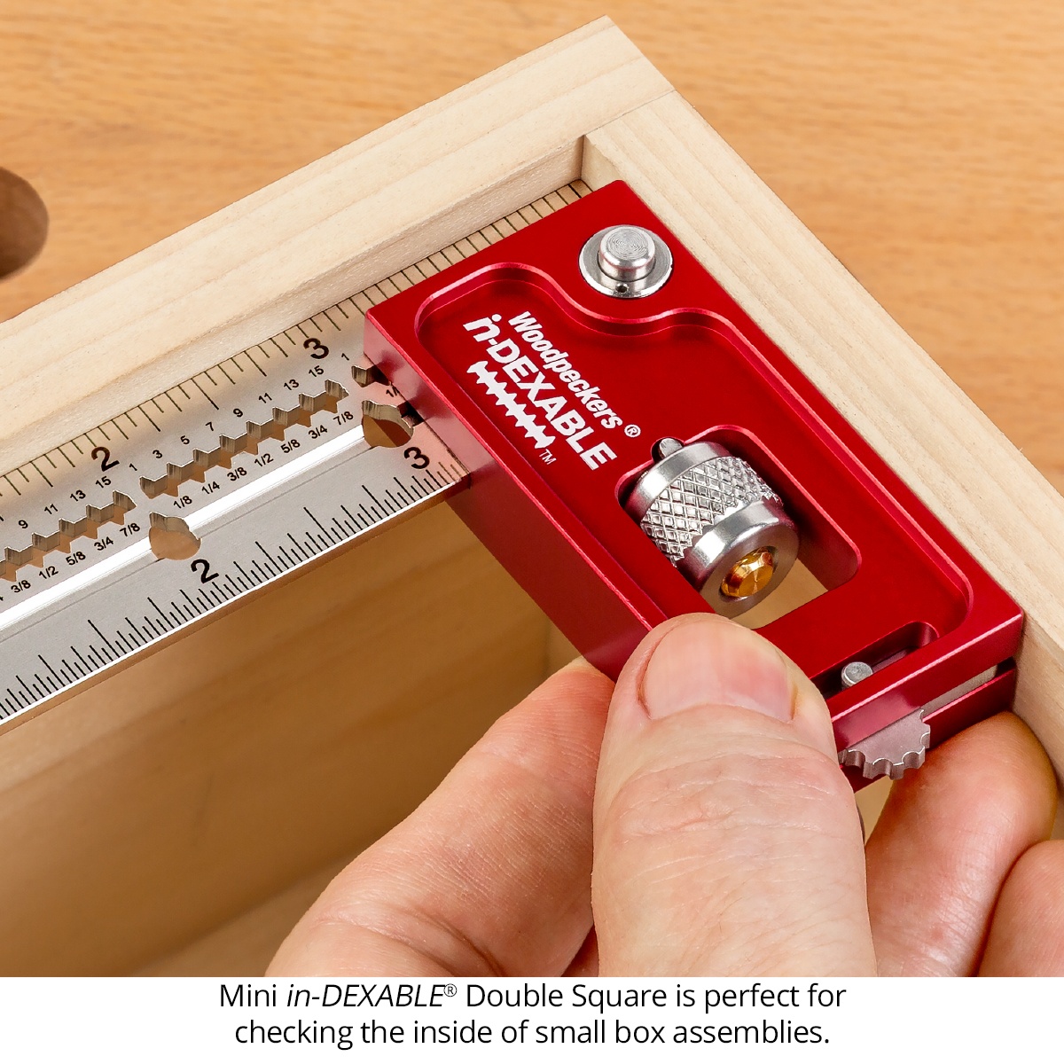 Woodpeckers MDSQ-21 Mini in-DEXABLE Double Square checking the inside corner of a small wooden box assembly on a workbench