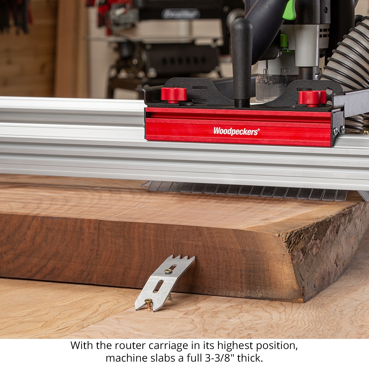 Woodpeckers Slab Flattening Mill Pro XL router carriage above a thick hardwood slab showing flattening capacity in a shop setting