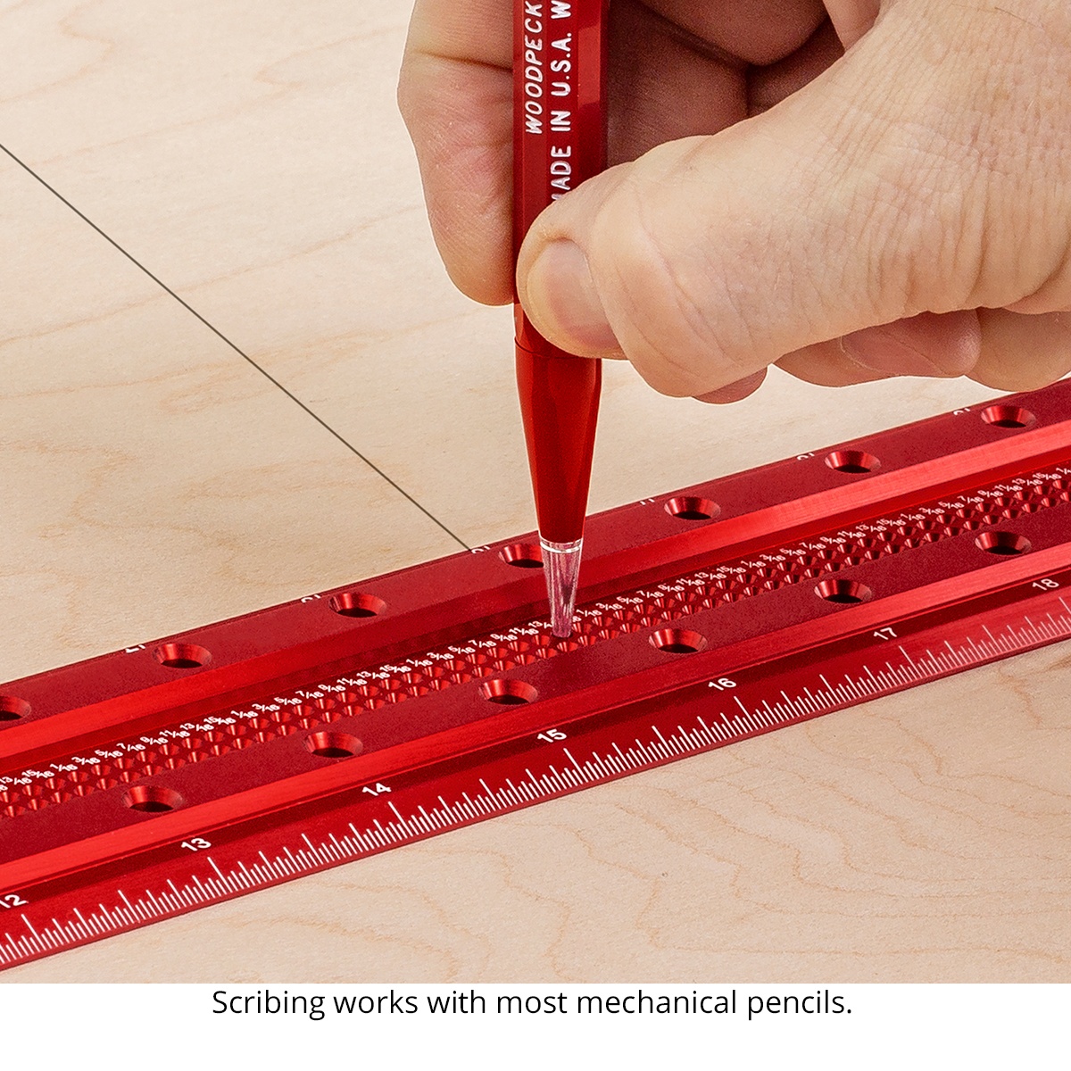 Close-up of the Woodpeckers TS-24-20 Precision Woodworking T-Square scribing holes with a mechanical pencil tip for accurate layout