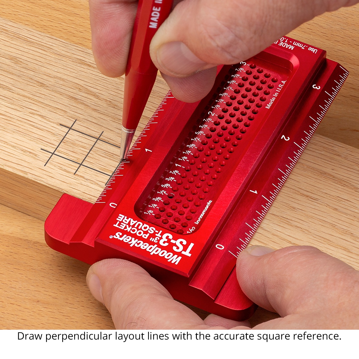 Woodpeckers Pocket T-Squares marking tool drawing a perpendicular layout line on a wood board with pencil through the hole grid