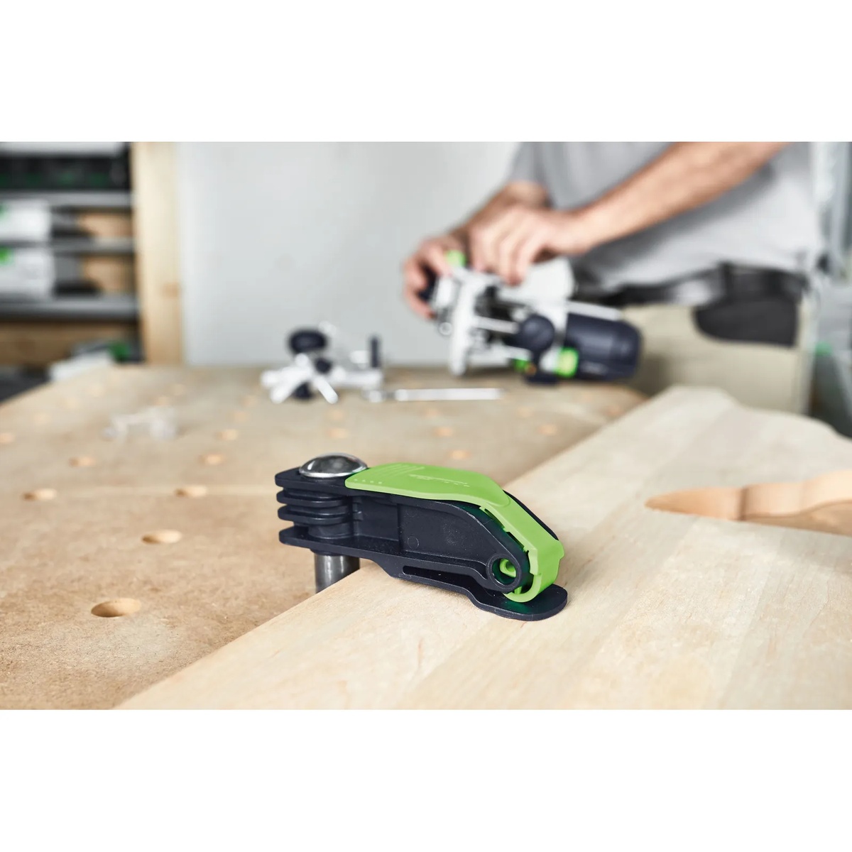 Festool Quick Clamp MFT-HZ 80 holding a wooden workpiece on a multifunction table while a user prepares for woodworking operations
