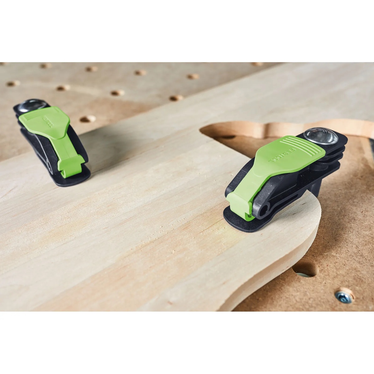 Festool Quick Clamp MFT-HZ 80 holding a shaped wood workpiece on an MFT bench for sanding or routing