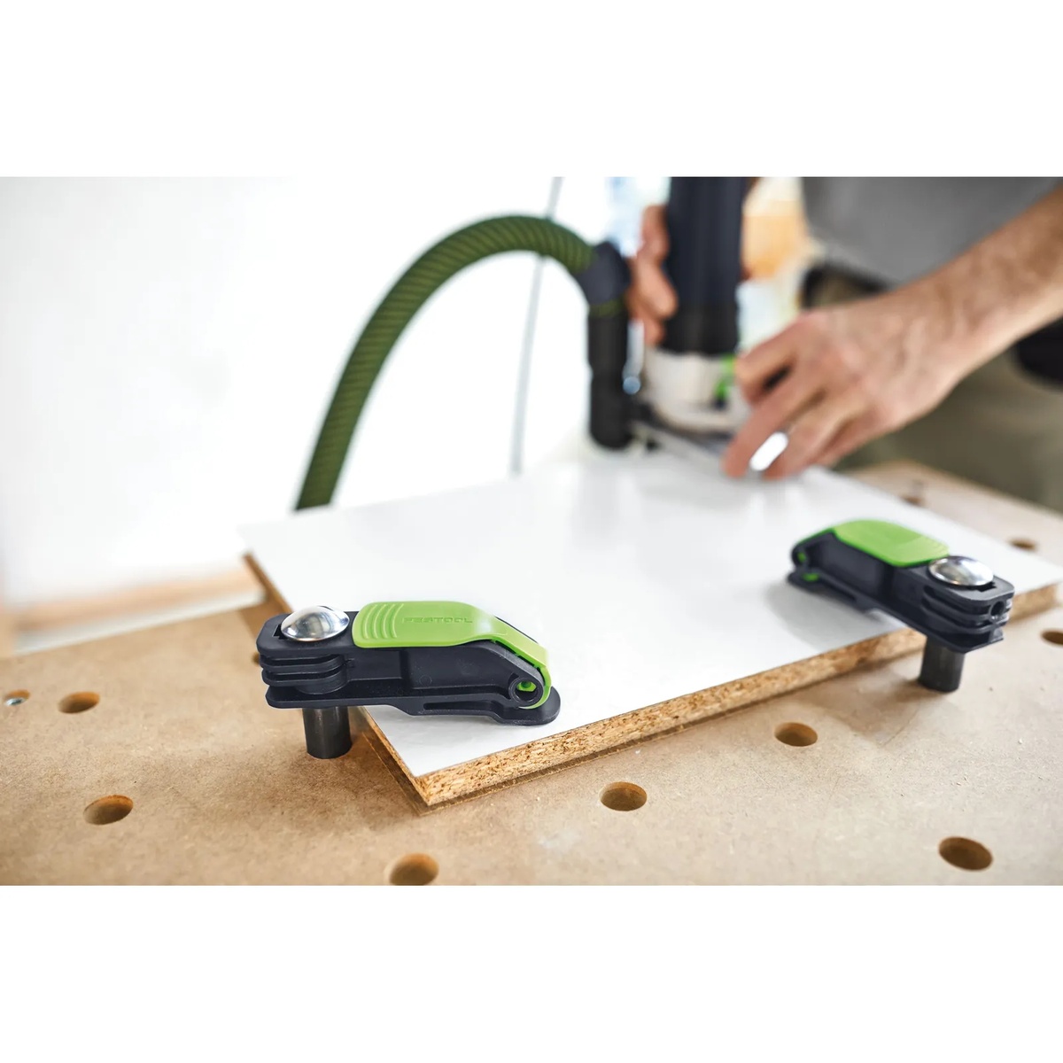 Festool Quick Clamp MFT-HZ 80 securing a panel on a Festool MFT worktable during routing and bench work in a shop setting