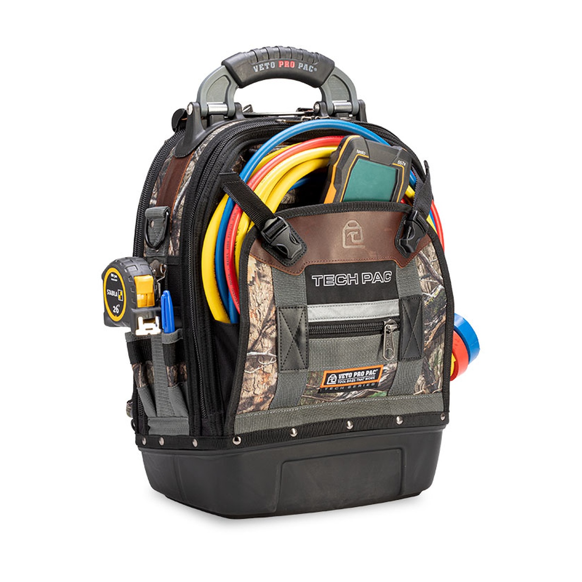 Veto Pro Pac Tech Pac Camo DNA backpack tool bag loaded with hoses, meter, and hand tools for HVAC service work
