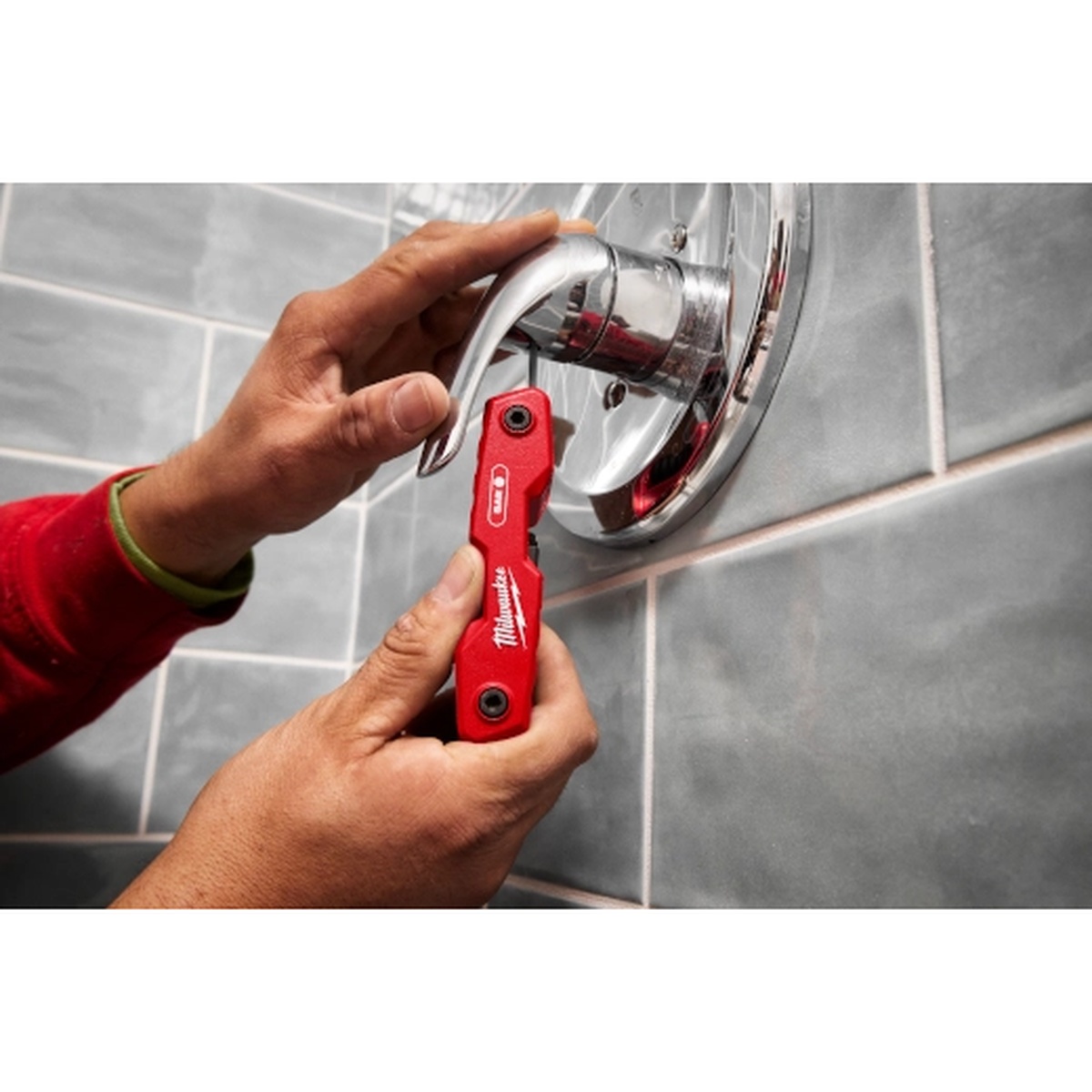 Milwaukee 48-22-2183 17-Piece Folding Hex Key Set - SAE & Metric engaging a recessed plumbing fixture set screw on finished trim