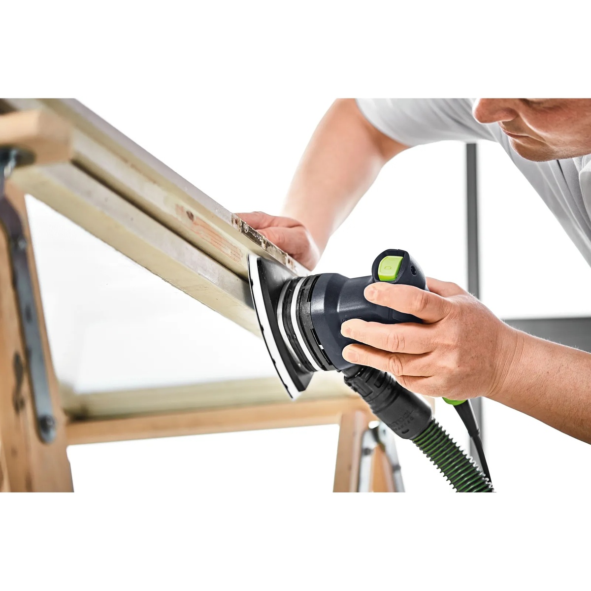 Festool DTS 400 REQ-Plus Finish Delta Sander used overhead on a painted wood frame for vertical finish sanding
