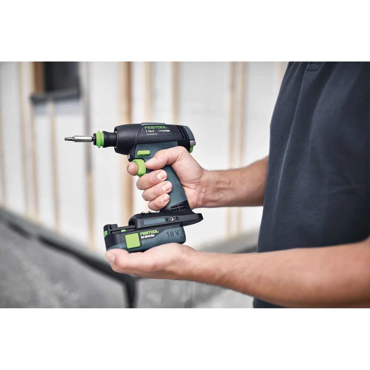 Festool 577607 T 18 Cordless Drill BASIC in hand with 18V battery pack during jobsite setup for drilling and fastening work