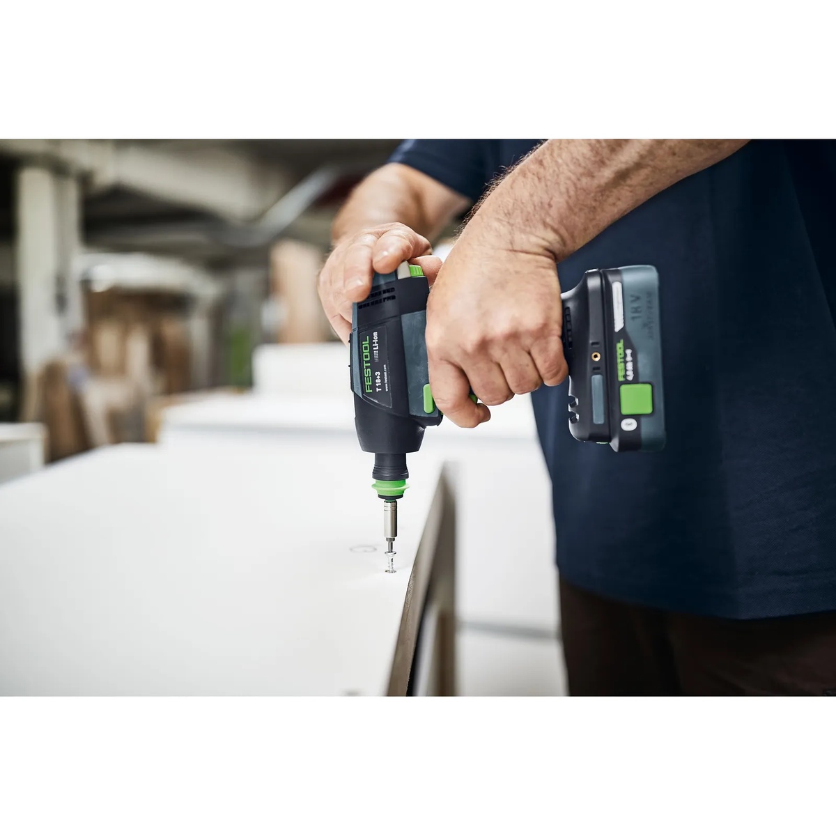 Festool 577607 T 18 Cordless Drill BASIC driving a screw into a panel during cabinet installation and finish fastening work