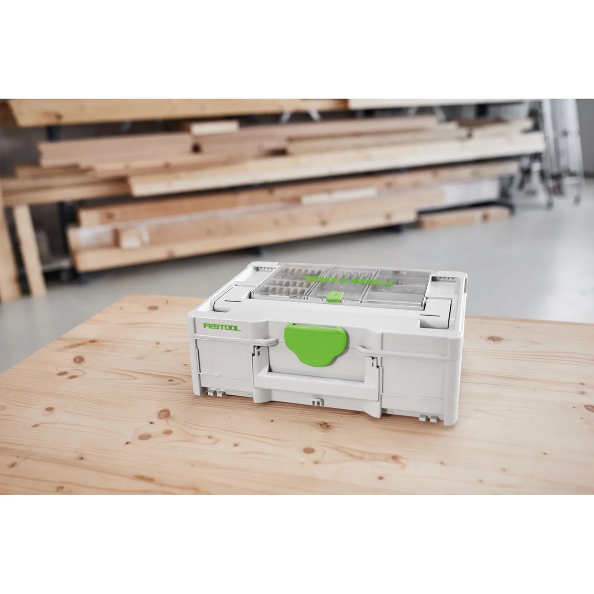 Festool storage box on a wood workbench showing how the Festool 577780 12-Piece Driver Bit Cassette BKS SYS3 50mm CE F integrates with Systainer organization
