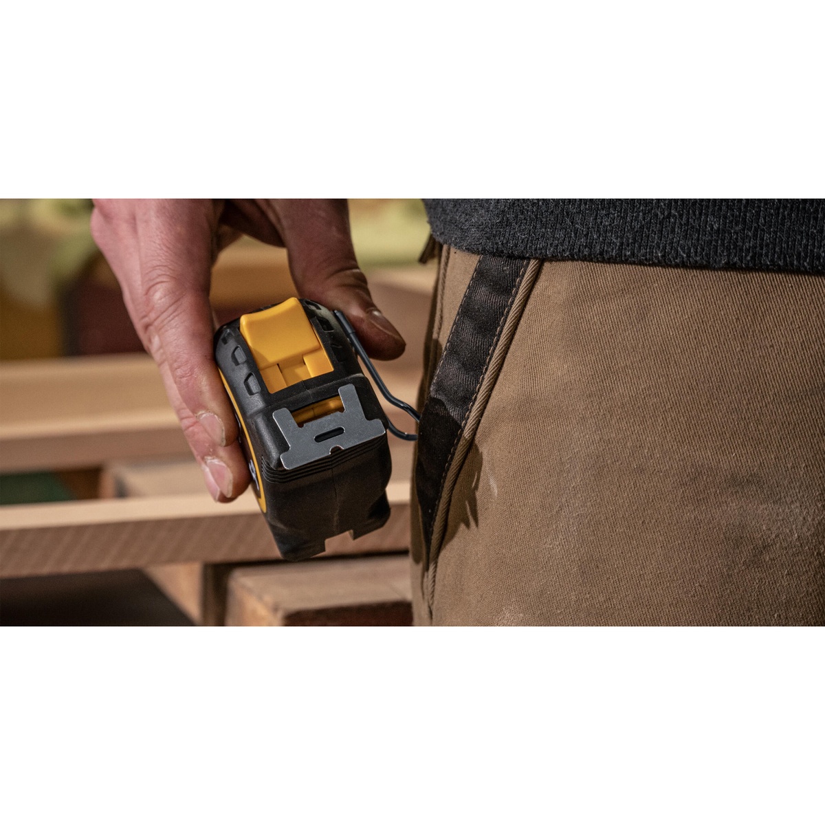 Stabila Tape Measure BM 300 26 Feet Inch clipped at a carpenter's pocket on a woodworking jobsite for everyday carry