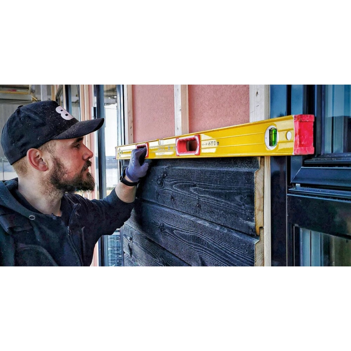 Stabila 78296 level set long spirit level checking straight exterior trim and window area during installation