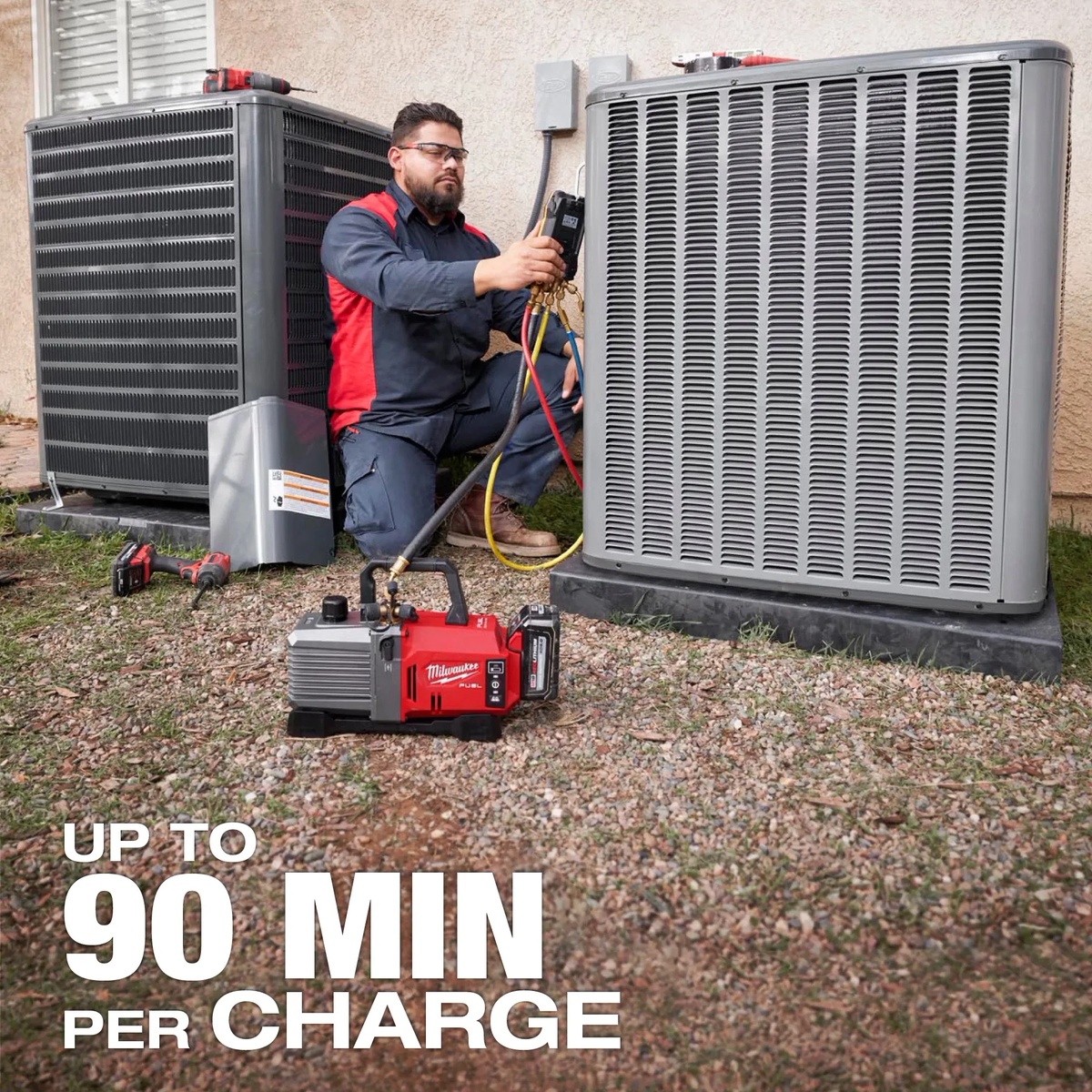 Milwaukee M18 FUEL 5 CFM Vacuum Pump Kit evacuating an outdoor air conditioning system beside residential condenser units during HVAC service work