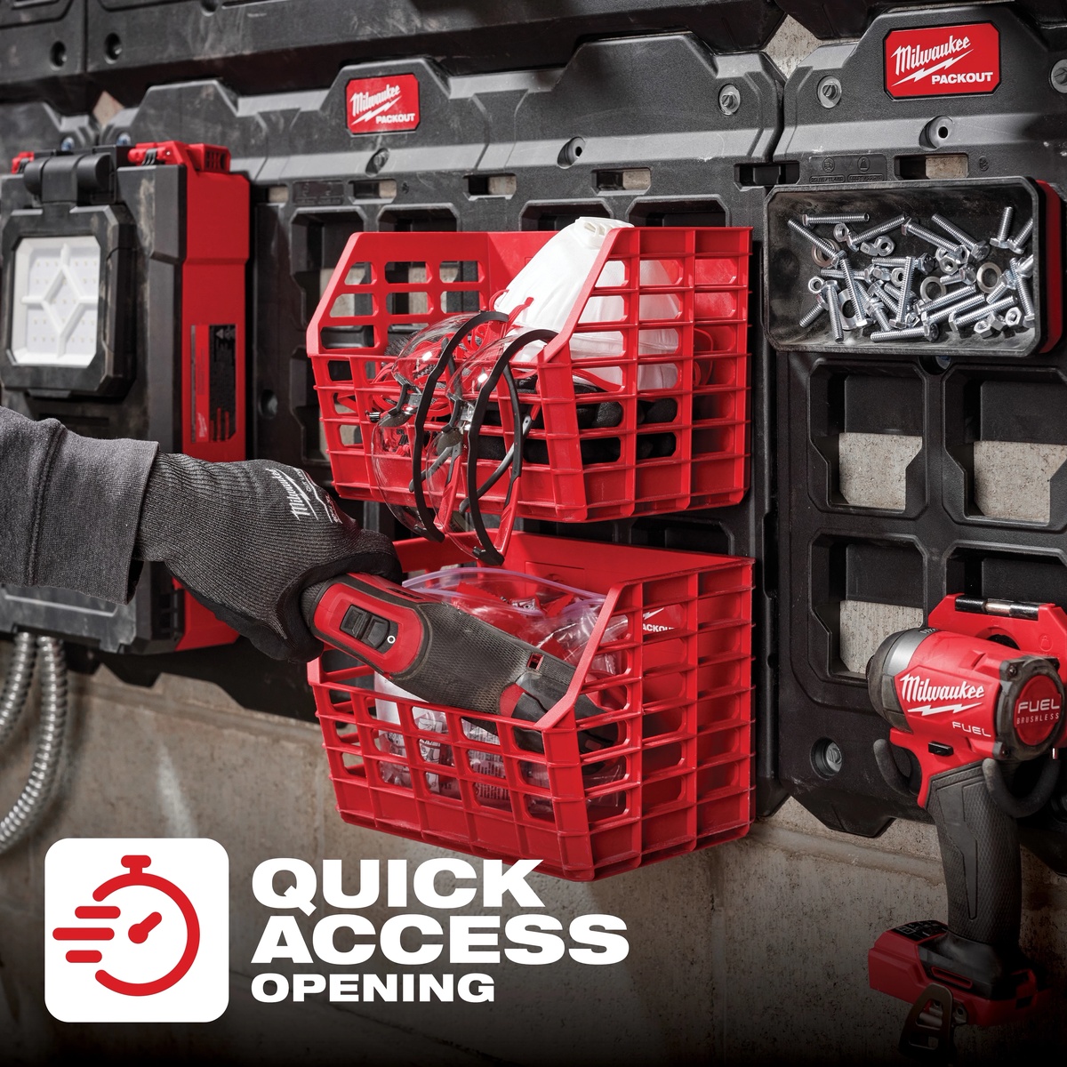 Milwaukee 48-22-8342 PACKOUT Compact Wall Mounted Tool Storage Basket mounted on a PACKOUT wall plate holding safety glasses and accessories in a working shop environment