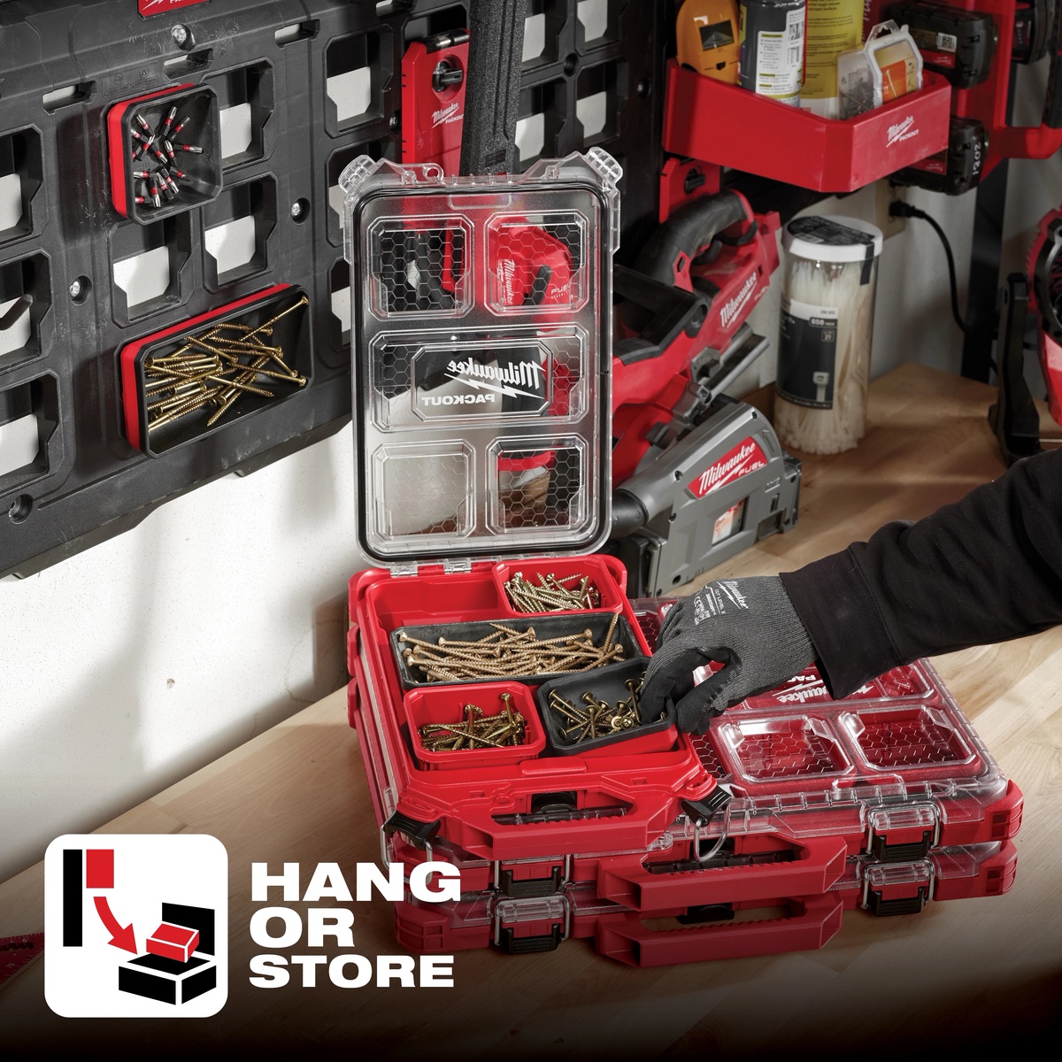 Milwaukee PACKOUT Magnetic Bin for Organizer mounted on a PACKOUT wall plate and used with screws and driver bits in a shop storage setup