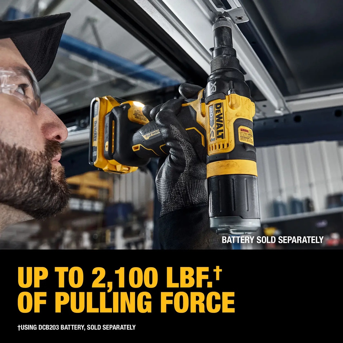 DEWALT 20V MAX XR Brushless Cordless 3/16 in. Rivet Tool fastening a blind rivet overhead in a metal frame during assembly work