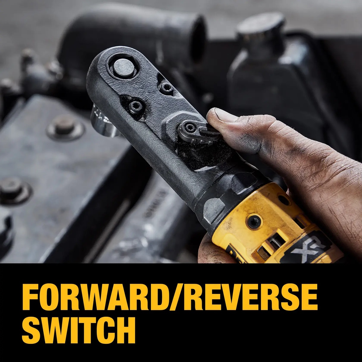 DEWALT DCF510B cordless ratchet forward reverse switch being adjusted during under-hood automotive service in a tight workspace