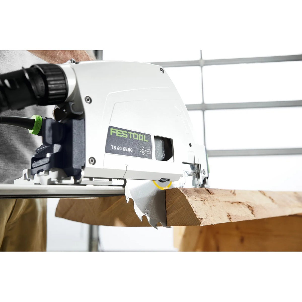 Festool 205770 WOOD RIP CUT HW 168x1,8x20 PW16 Saw Blade installed in a Festool plunge-cut saw making a rip cut through thick solid wood on a guided jobsite setup