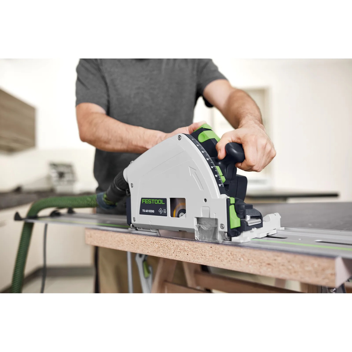 Festool plunge saw using the Festool 205772 WOOD FINE CUT HW 168x1,8x20 WD42 Saw Blade on a guide rail for accurate panel cutting in a workshop