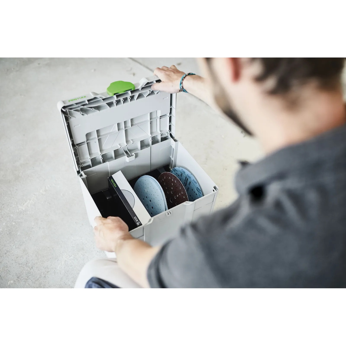 Festool 576786 SYS-STF-D225 Planex Abrasives M 337 Systainer3 opened on a jobsite floor with 225 mm sanding discs sorted inside for drywall sanding work