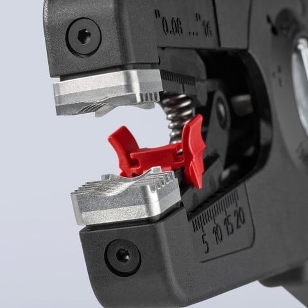 Knipex 7 3/4 in. PreciStrip16 Automatic Wire Stripper 6-28 AWG close-up of the stripping jaws and wire guide during electrical wire preparation on fine and solid conductors