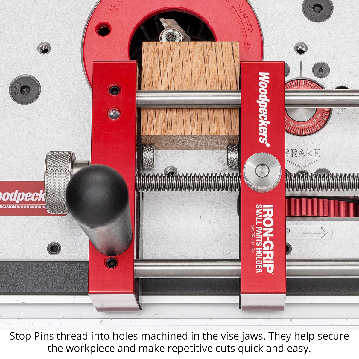 Close-up of Woodpeckers Iron-Grip Small Parts Holder stop pins securing a small wood part for repeat router table cuts