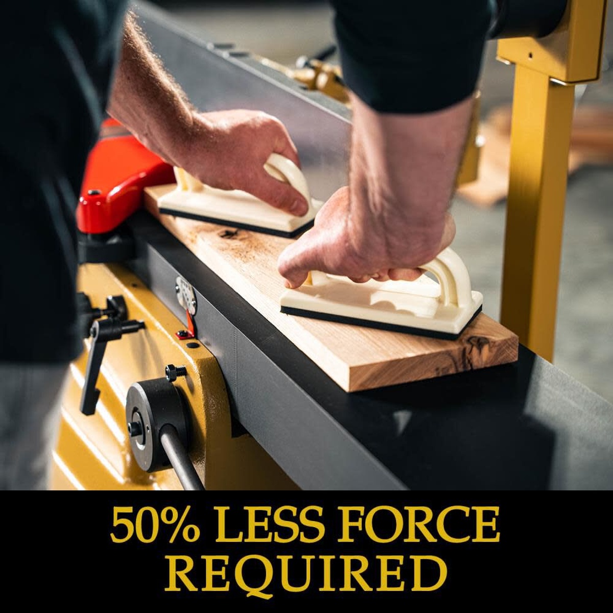 Powermatic PJ882T Jointer 2HP 1PH 230V SH ArmorGlide flattening a long hardwood board with push blocks during stock preparation